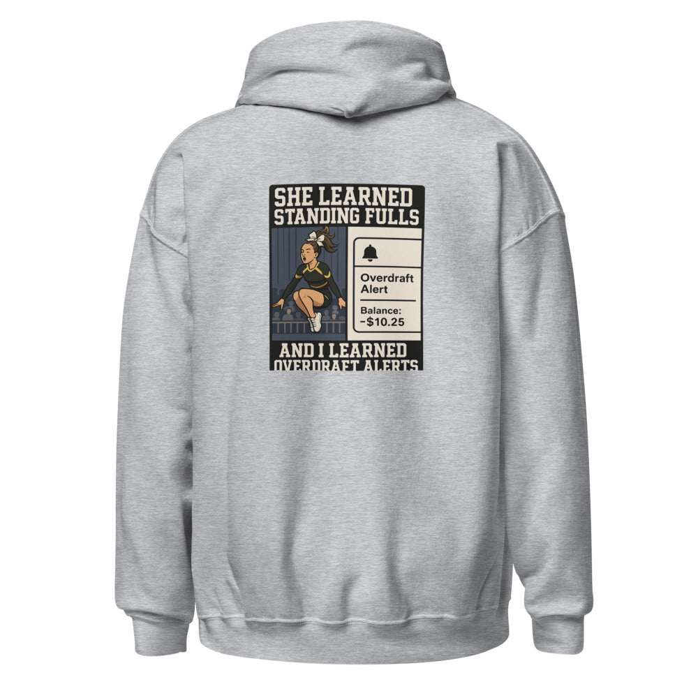 Black competitive cheerleading hoodie with "Cheer Dad" slogan displayed prominently.