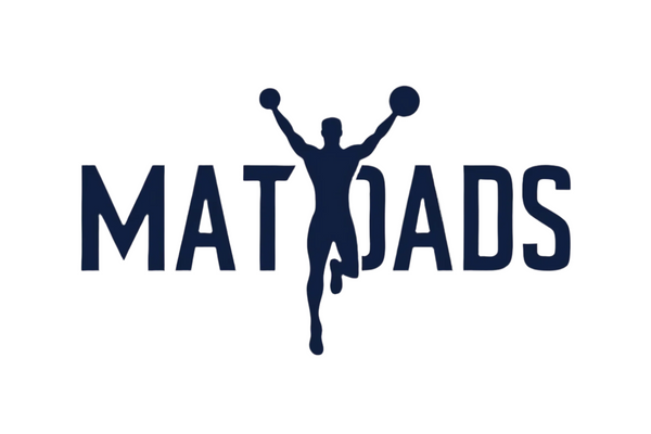 MatDads Logo with part of the first D blocked by a male silhouette in a cheer pose with arms raised and knee bent, but with basketballs in his hands rather than poms